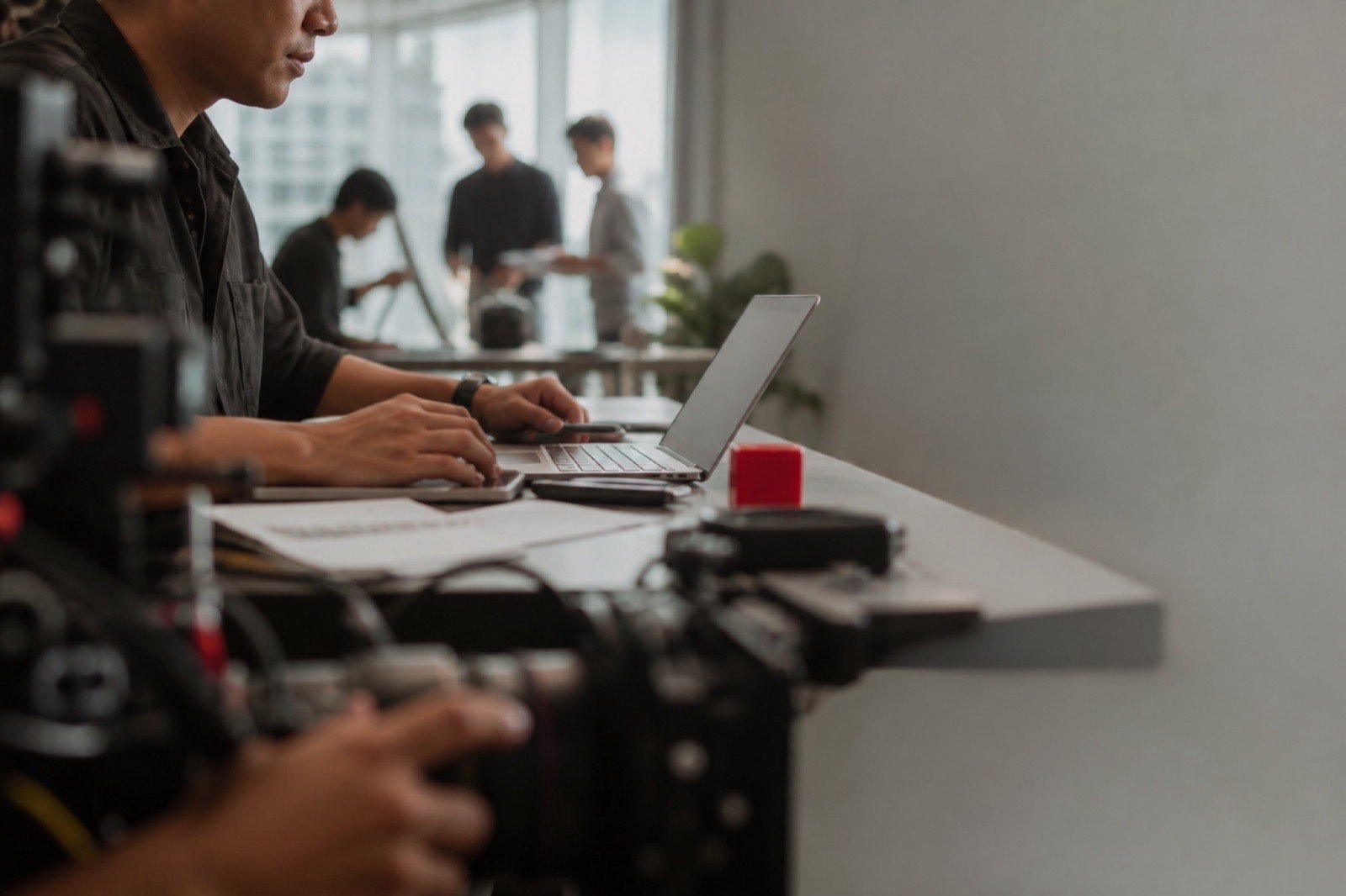 A Filipino operations lead working in a bright creative studio